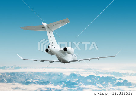 White luxury executive airplane flying over snow covered mountain ranges White luxury executive airplane flying over snow covered mountain ranges 122318518