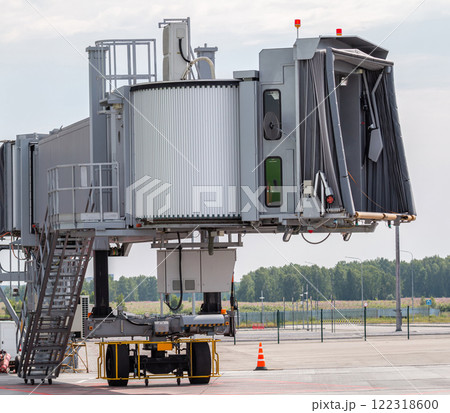 Close-up empty passenger air bridge at airport apron Close-up empty passenger air bridge at airport apron 122318600