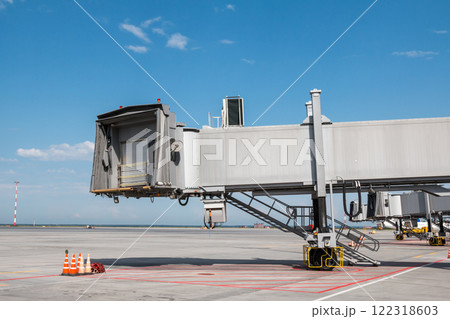 Empty passenger jet bridges at airport apron 122318603