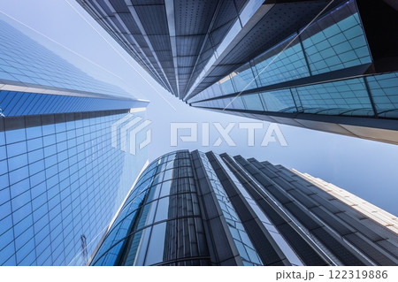 Modern Skyscrapers in London with Glass Facades and Clear Sky Modern Skyscrapers in London with Glass Facades and Clear Sky 122319886