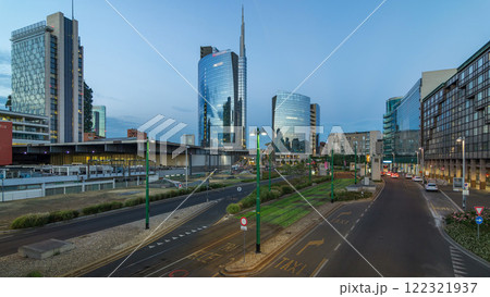Milan skyline with modern skyscrapers in Porta Nuova business district day to night timelapse in Milan, Italy, after sunset. 122321937