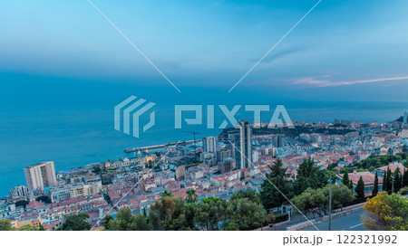 Cityscape of Monte Carlo, Monaco day to night timelapse with roofs of buildings after summer sunset. 122321992