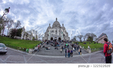 Crowd of tourists walking near Sacre Coeur Basilica in spring day timelapse Paris, France 122322020