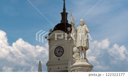 Monument to explorer Christopher Columbus and tower with watch on the Columbus square timelapse hyperlapse. Monument to explorer Christopher Columbus and tower with watch on the Columbus square timelapse hyperlapse. 122322177