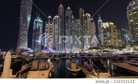 Dubai Marina with tallest skyscrapers and boats night timelapse hyperlapse 122323123
