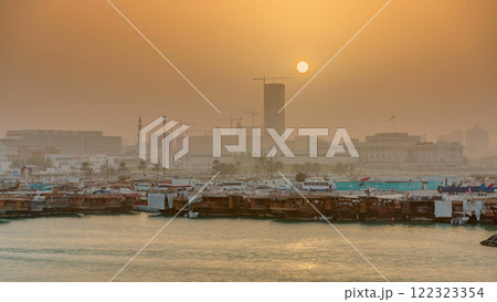 Sunset at Doha Bay timelapse with Traditional Wooden Dhow Fishing Boats. Sunset at Doha Bay timelapse with Traditional Wooden Dhow Fishing Boats. 122323354