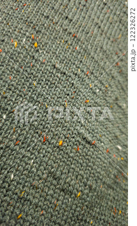 Knitted product from dark threads. Knitting a neck for a men's sweater. 122326272