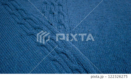 Knitted product from blue threads. Ready-made handmade women's sweater. 122326275