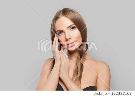 Glamorous young healthy woman with pigtail hairstyle and natural make-up on white background Glamorous young healthy woman with pigtail hairstyle and natural make-up on white background 122327168