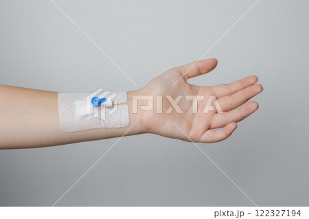 Female hand with Peripheral venous catheter on white background 122327194
