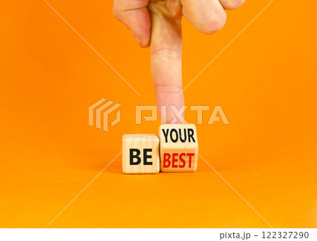 Motivational be your best symbol. Concept words Be your best on beautiful wooden block. Beautiful orange background Businessman hand. Business motivational be your best concept. Copy space. 122327290