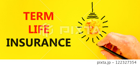 Term life insurance symbol. Concept words Term life insurance on beautiful yellow paper. Beautiful yellow background. Businessman hand with black pen. Business term life insurance concept. Copy space. 122327354