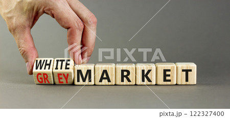 Grey or white market symbol. Concept words Grey market or White market on beautiful wooden blocks. Beautiful grey background. Businessman hand. Business grey or white market concept. Copy space. 122327400