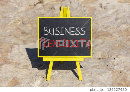Business flexibility symbol. Concept words Business flexibility on beautiful yellow blackboard. Beautiful red stone beach background. Business flexibility concept. Copy space. 122327420