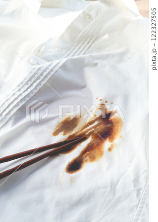 White shirt stained with soy sauce and chopsticks lying on it, no people, close-up , selective focus, 122327505