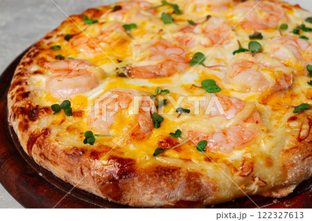 four cheese pizza with shrimp and fresh microgreens, served on a wooden board, homemade, no people, four cheese pizza with shrimp and fresh microgreens, served on a wooden board, homemade, no people, 122327613
