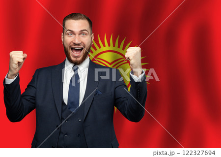 Kyrgyz happy businessman on the background of flag of Kyrgyzstan Business, education 122327694