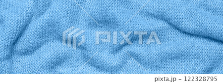 Close up texture of blue crumpled woven fabric with a subtle pattern of evenly spaced tiny dots, providing a soft, neutral background ideal for design and creative projects. Long horizontal banner Close up texture of blue crumpled woven fabric with a subtle pattern of evenly spaced tiny dots, providing a soft, neutral background ideal for design and creative projects. Long horizontal banner 122328795