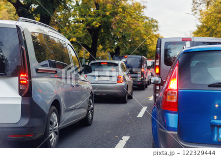 Back tail view of many cars stuck in row at Berlin city street road traffic jam. Automobile accident vehicle rush hour collapse. Town transport commute infrastructure blockage strike Back tail view of many cars stuck in row at Berlin city street road traffic jam. Automobile accident vehicle rush hour collapse. Town transport commute infrastructure blockage strike 122329444