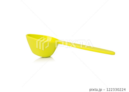 Green measuring spoon isolated on white background Green measuring spoon isolated on white background 122330224