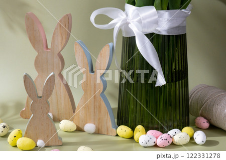 Happy EASTER composition wooden bunny eggs Fresh bouquet of colorful tulip flowers in pastel background with shadows. Minimalist design greeting card for springtime holidays. Gift for Easter. 122331278