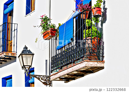 Typical white facades with flowers on the balconies of the streets of the famous Peniscola castle, Castellon, Valencian Community, Spain Typical white facades with flowers on the balconies of the streets of the famous Peniscola castle, Castellon, Valencian Community, Spain 122332668