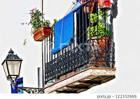 Typical white facades with flowers on the balconies of the streets of the famous Peniscola castle, Castellon, Valencian Community, Spain Typical white facades with flowers on the balconies of the streets of the famous Peniscola castle, Castellon, Valencian Community, Spain 122332669
