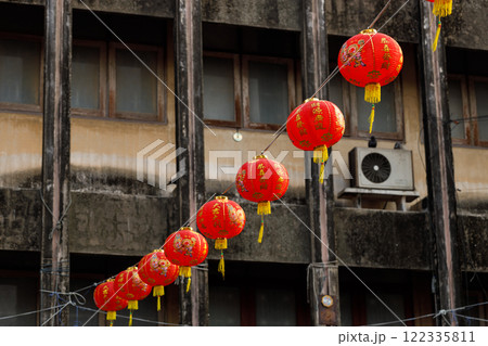Lunar or Chinese new year lanterns decorated over street in old town. The letters mean Luck, Congratulations, Blessing and Happiness Lunar or Chinese new year lanterns decorated over street in old town. The letters mean Luck, Congratulations, Blessing and Happiness 122335811