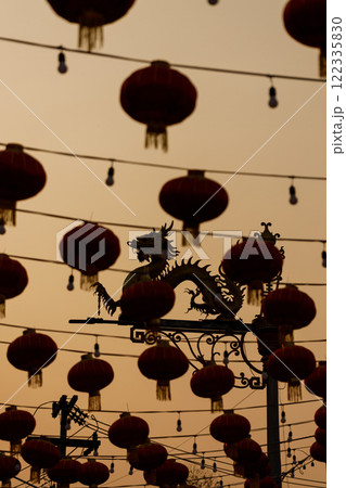 Lunar or Chinese new year lanterns decorated against dragon shape lamp post Lunar or Chinese new year lanterns decorated against dragon shape lamp post 122335830