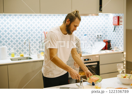 Enjoying the delightful experience of cooking together in a modern and stylish kitchen 122336789
