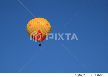 Yellow orange hot air balloon over Vang Vieng, Laos. Yellow orange hot air balloon over Vang Vieng, Laos. 122336889