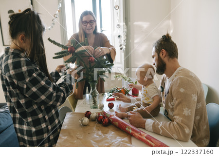 A Family Coming Together to Decorate for Christmas with Fun and Creative Crafts Activities A Family Coming Together to Decorate for Christmas with Fun and Creative Crafts Activities 122337160