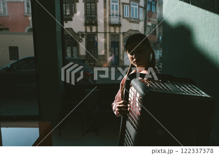 An Urban Scene featuring a Figurative Presence illuminated by Natural Light and ambiance An Urban Scene featuring a Figurative Presence illuminated by Natural Light and ambiance 122337378