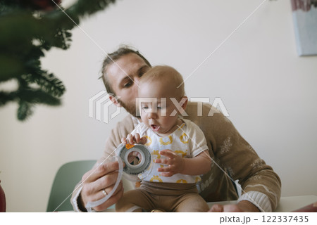 A Heartwarming Bonding Experience Between a Father and His Baby During Holiday Preparations A Heartwarming Bonding Experience Between a Father and His Baby During Holiday Preparations 122337435
