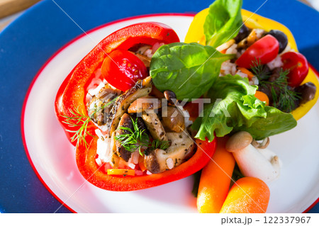 Peppers stuffed with wild mushrooms, rice, herbs, vegetables 122337967
