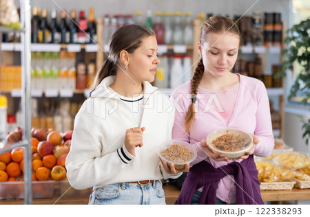 Two friends choosing noodles for lunch Two friends choosing noodles for lunch 122338293