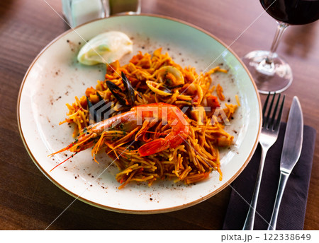 Seafood fideua, rich in taste, unforgettable dish Seafood fideua, rich in taste, unforgettable dish 122338649