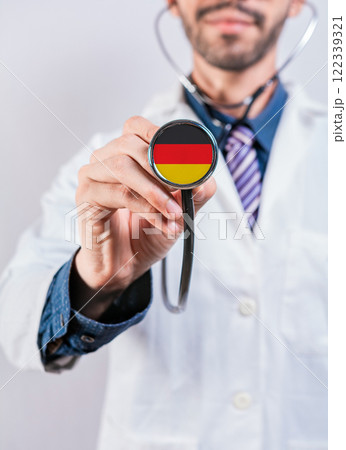 Germany health and medical insurance concept. Germany Healthcare System, doctor holding stethoscope Germany health and medical insurance concept. Germany Healthcare System, doctor holding stethoscope 122339321