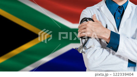 Doctor with stethoscope on South Africa flag. Doctor holding stethoscope on South Africa flag 122339404