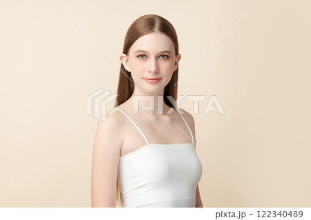 Beautiful young woman with clean fresh skin on beige background, Face care, Facial treatment, Cosmetology, beauty and spa, women portrait. Beautiful young woman with clean fresh skin on beige background, Face care, Facial treatment, Cosmetology, beauty and spa, women portrait. 122340489