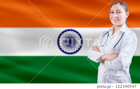 Female doctor on India flag. Doctor with crossed arms on India flag. India Health and Care concept 122340547
