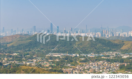 Jan 11 2025 a City Surrounded by Hills and Green Valleys 122343056