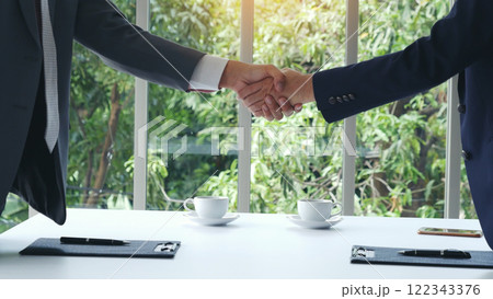 Businessman handshake manager recruitment team business. Partners shaking hands together greeting mergers and acquisitions. Shakehand Teamwork Partnership in office meeting room. Business concept Businessman handshake manager recruitment team business. Partners shaking hands together greeting mergers and acquisitions. Shakehand Teamwork Partnership in office meeting room. Business concept 122343376