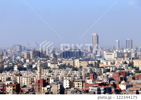Aerial view cityscape of Cairo with residential districts and Great Pyramids. Top view of Cairo, capital of Egypt. High angle view from the Cairo Citadel 122344175