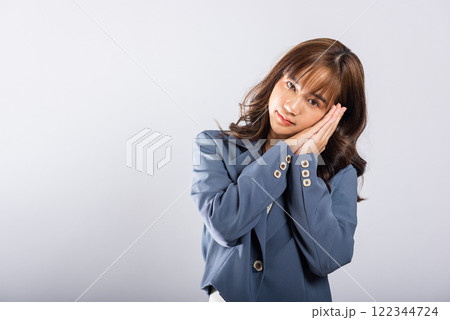 Portrait Asian beautiful young business woman pretended emotions sleeping tired eyes closed dreaming with hands together near face, studio shot on white background, insomnia concept, copy space Portrait Asian beautiful young business woman pretended emotions sleeping tired eyes closed dreaming with hands together near face, studio shot on white background, insomnia concept, copy space 122344724