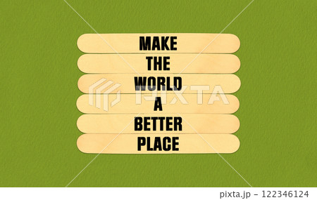 Make a Better World Symbol. Concept word Make The World A Better Place on beautiful wooden stick. Beautiful Green Chart Paper Background. Business and Make a Better World concept. Copy space 122346124