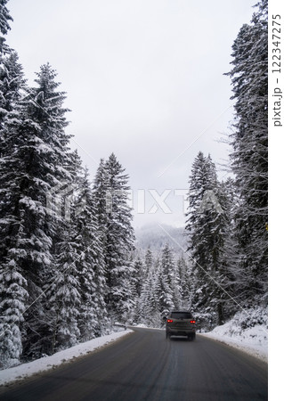 Car on Snowy Mountain Road 122347275
