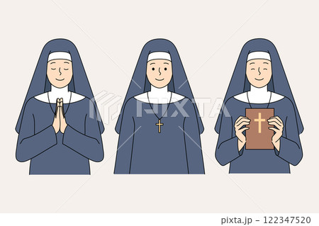 Catholic nun praying and holding bible to read gospel and worship jesus in christian church 122347520