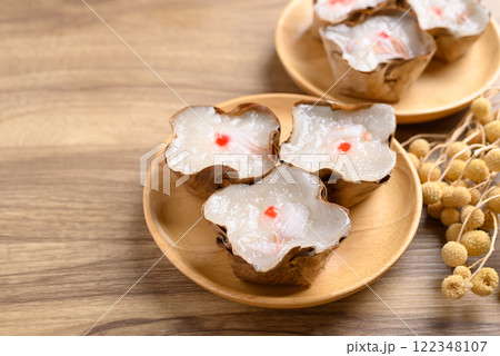 Sticky rice cake with coconut filling on wooden background, Chinese New Year cake 122348107