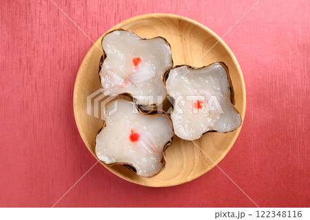 Sticky rice cake with coconut filling on red background, Chinese New Year cake 122348116